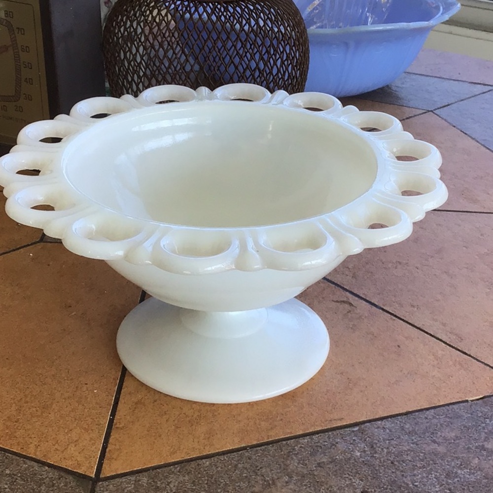 Milk glass compote with lace edge.